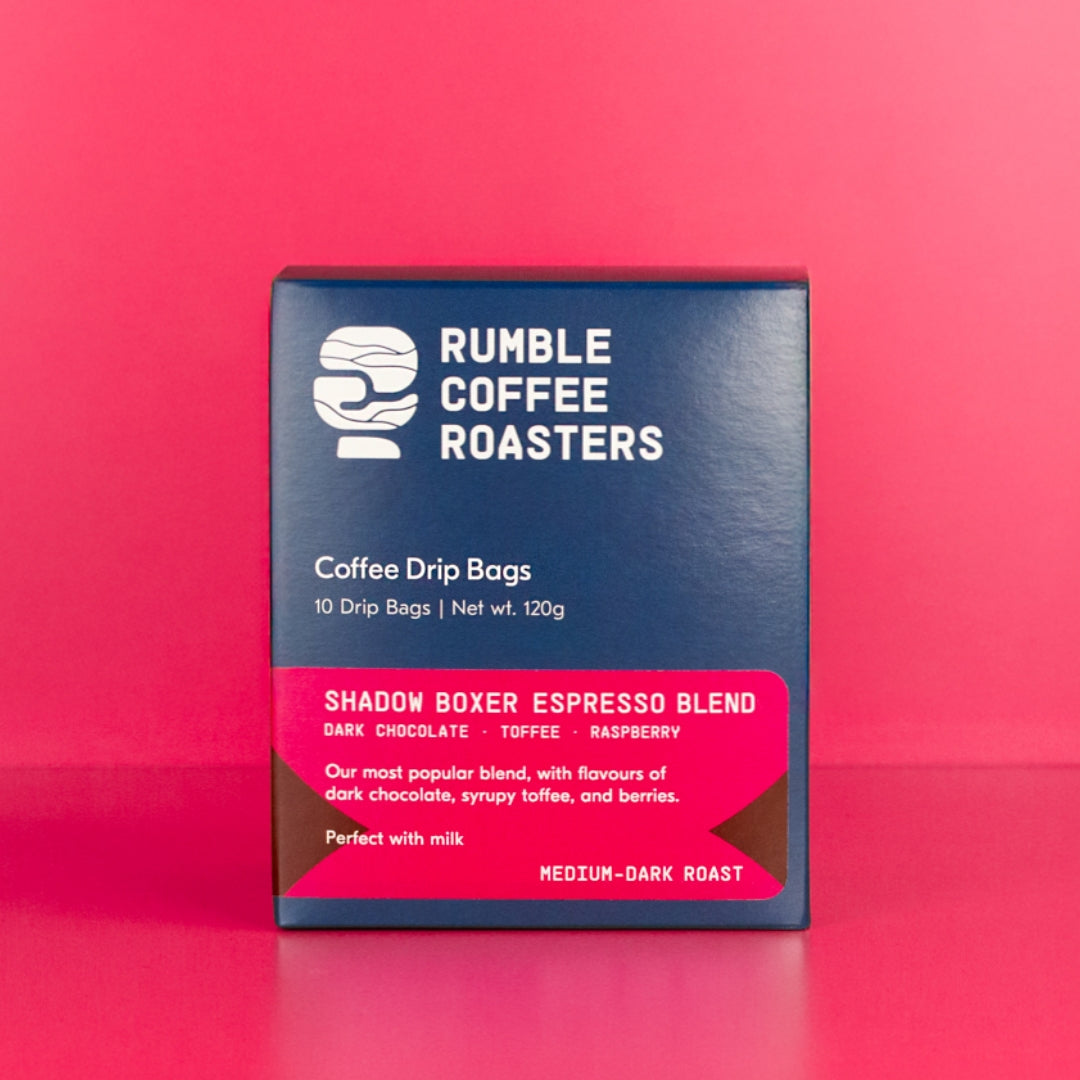 Box of Rumble Coffee Roasters coffee drip bags on a red background